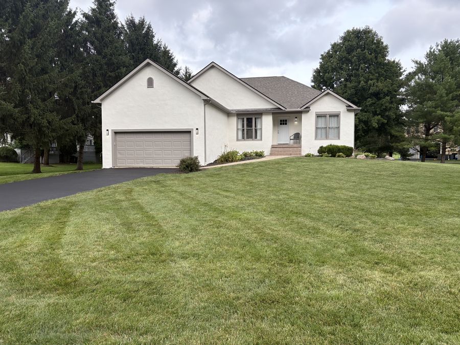 Completed exterior stucco repaint on a home in Galena, OH by A&A Painting