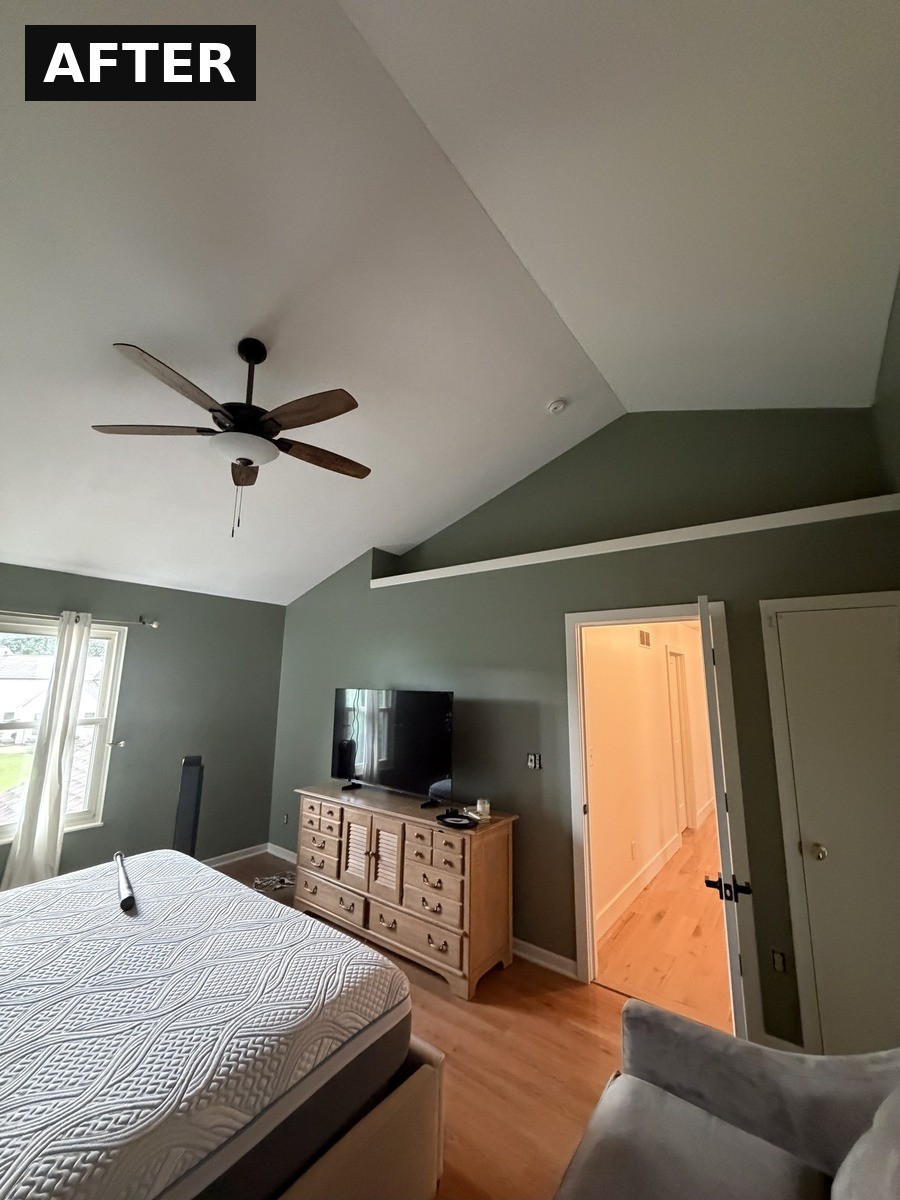 After: bedroom painted in a deep sage green with crisp white vaulted ceiling in Westerville, OH